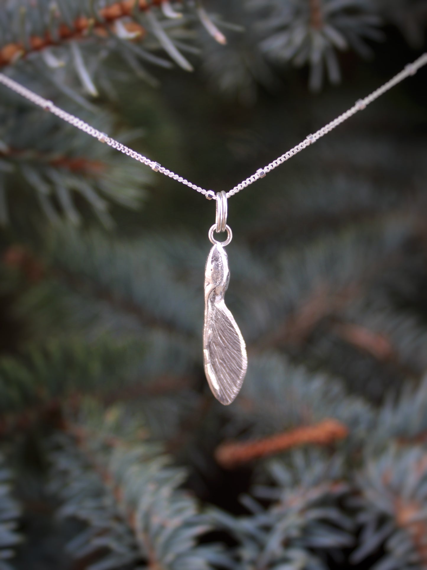 Solace in Flight Pendant: Sterling Silver Maple Samara