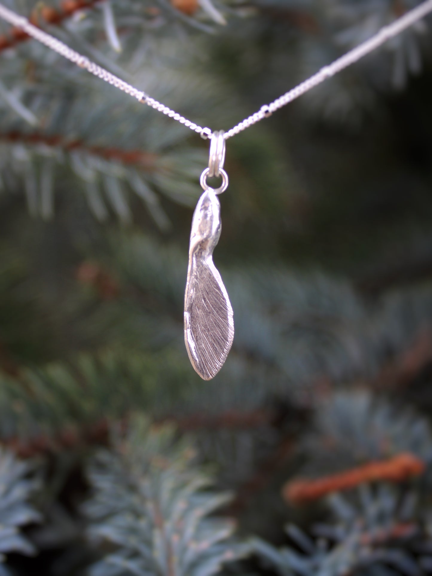 Solace in Flight Pendant: Sterling Silver Maple Samara