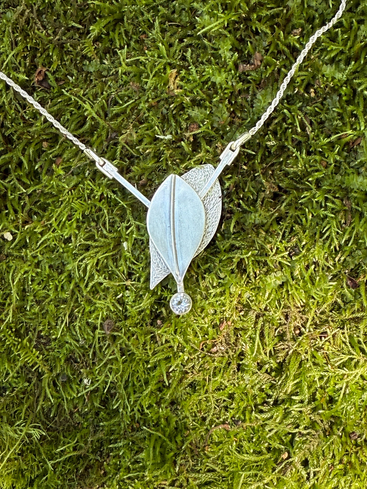 Radiant Renewal Necklace: Sterling Silver & White Topaz Leaf Pendant