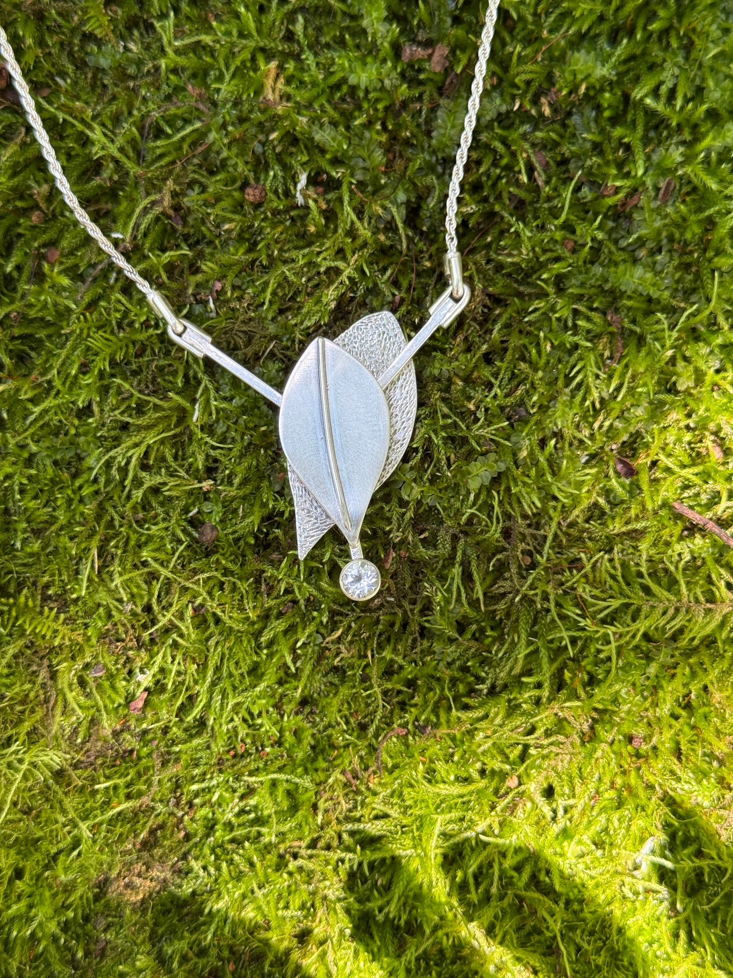 Radiant Renewal Necklace: Sterling Silver & White Topaz Leaf Pendant