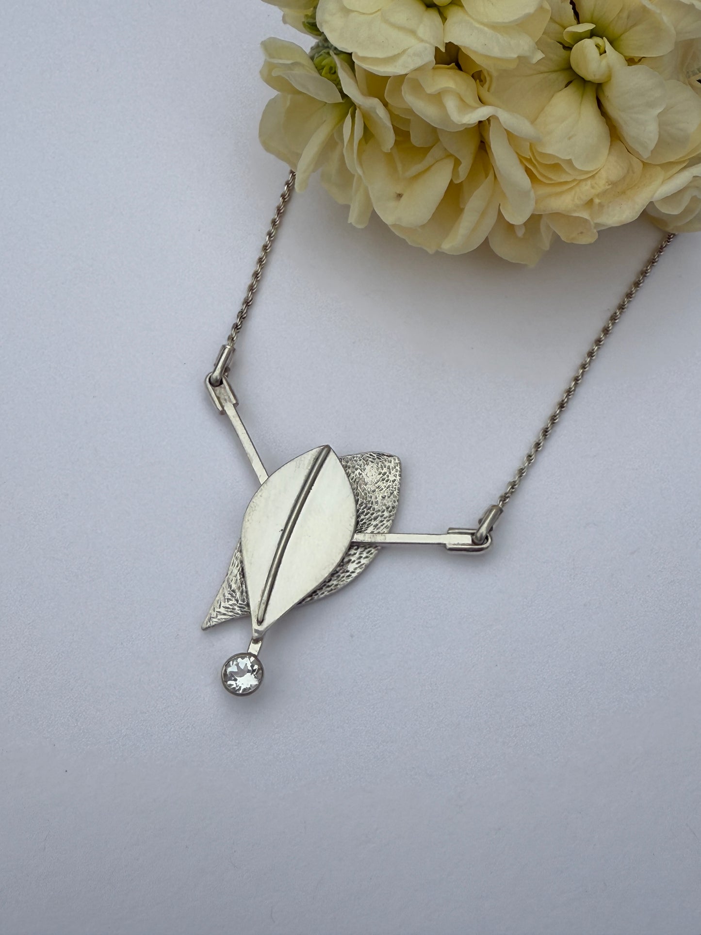 Radiant Renewal Necklace: Sterling Silver & White Topaz Leaf Pendant