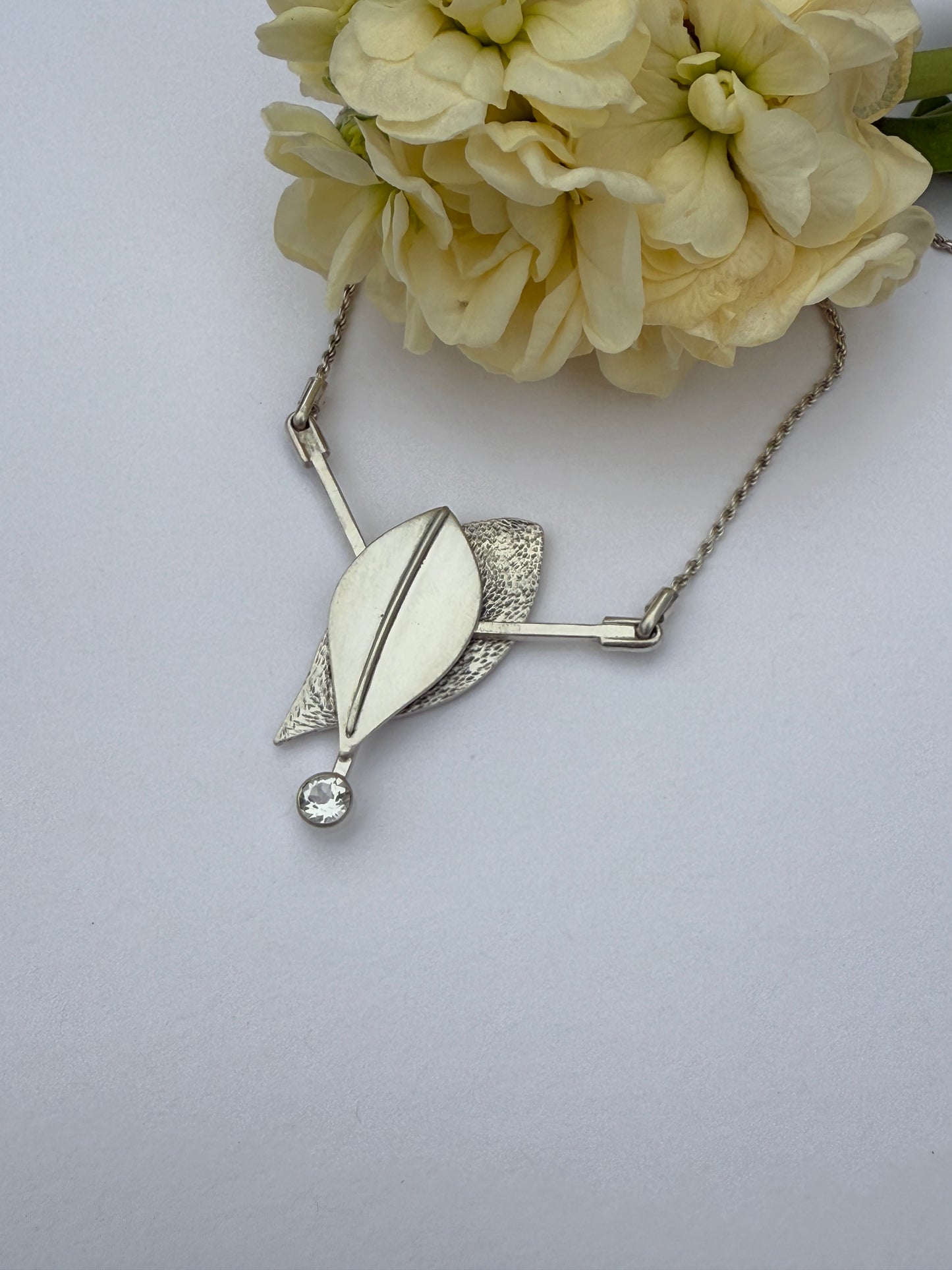Radiant Renewal Necklace: Sterling Silver & White Topaz Leaf Pendant