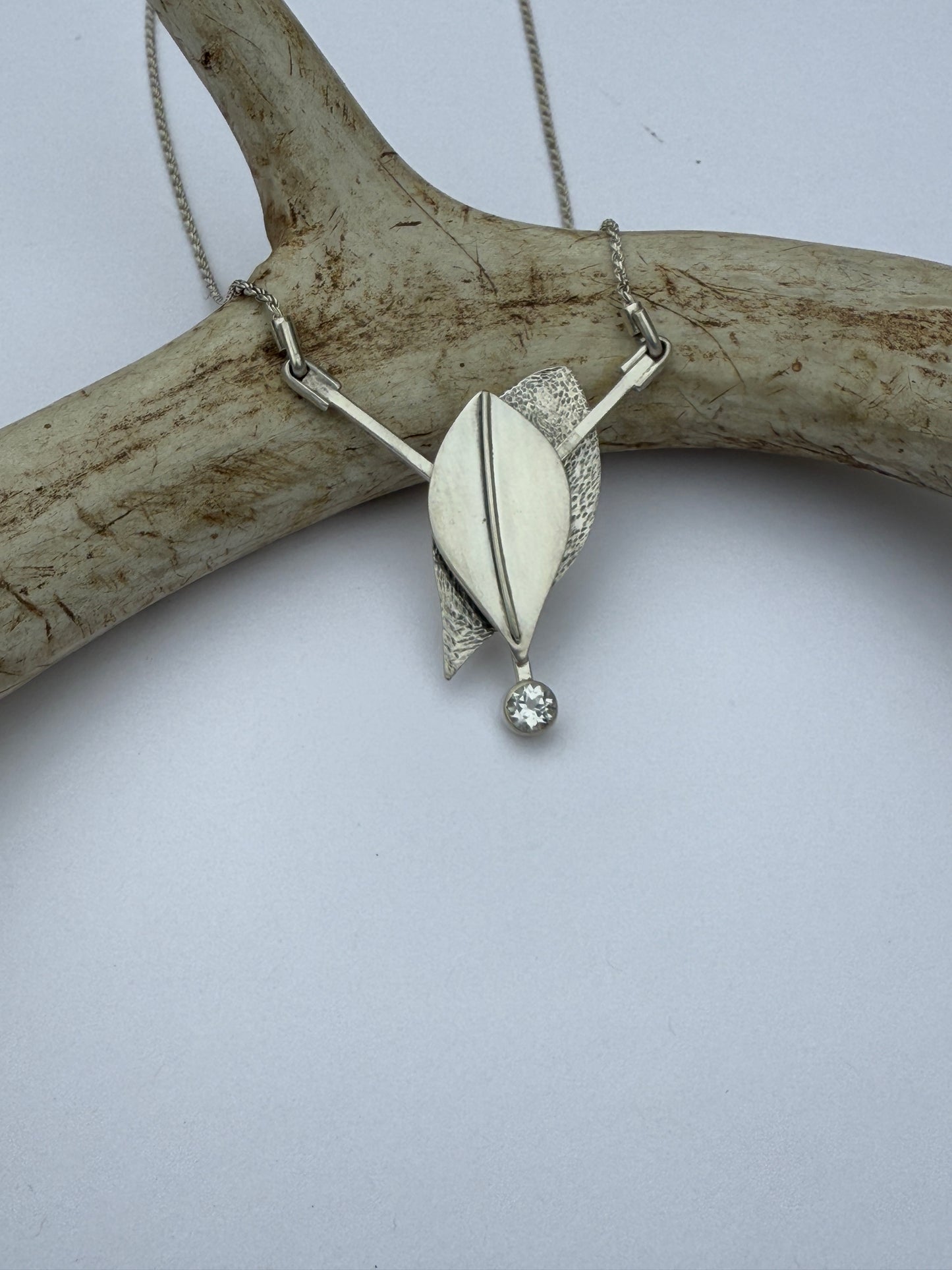 Radiant Renewal Necklace: Sterling Silver & White Topaz Leaf Pendant