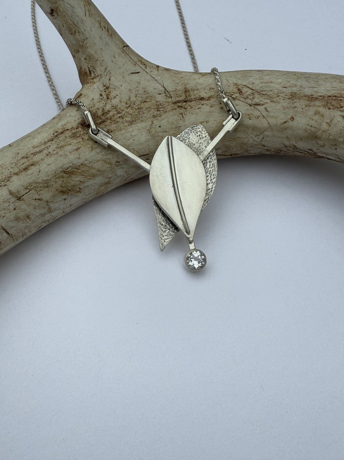 Radiant Renewal Necklace: Sterling Silver & White Topaz Leaf Pendant