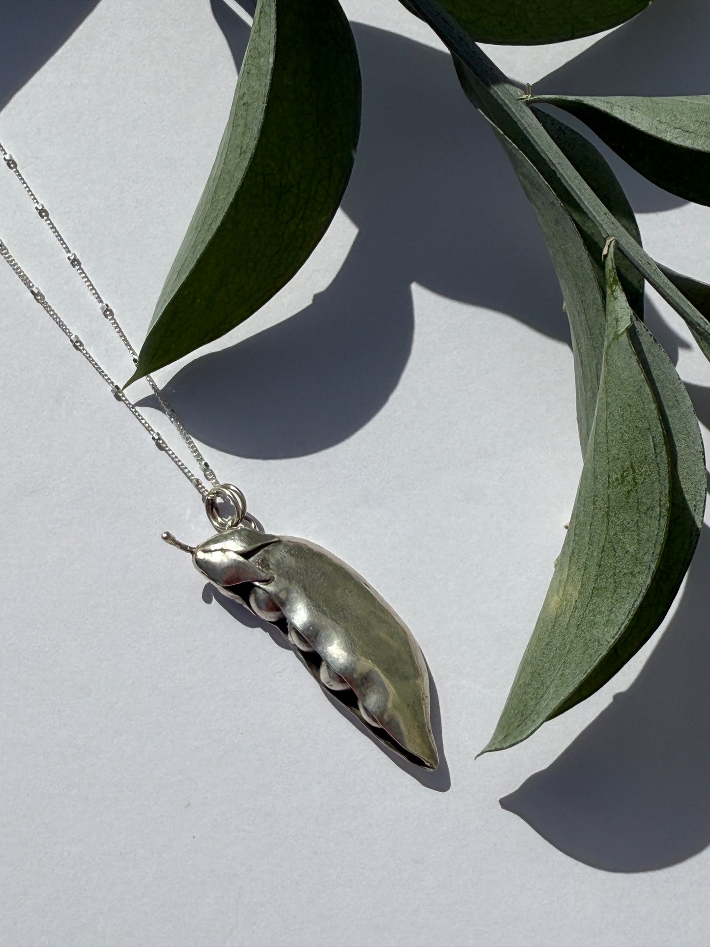 Seeds of Wonder Necklace: Sterling Silver Peapod Pendant