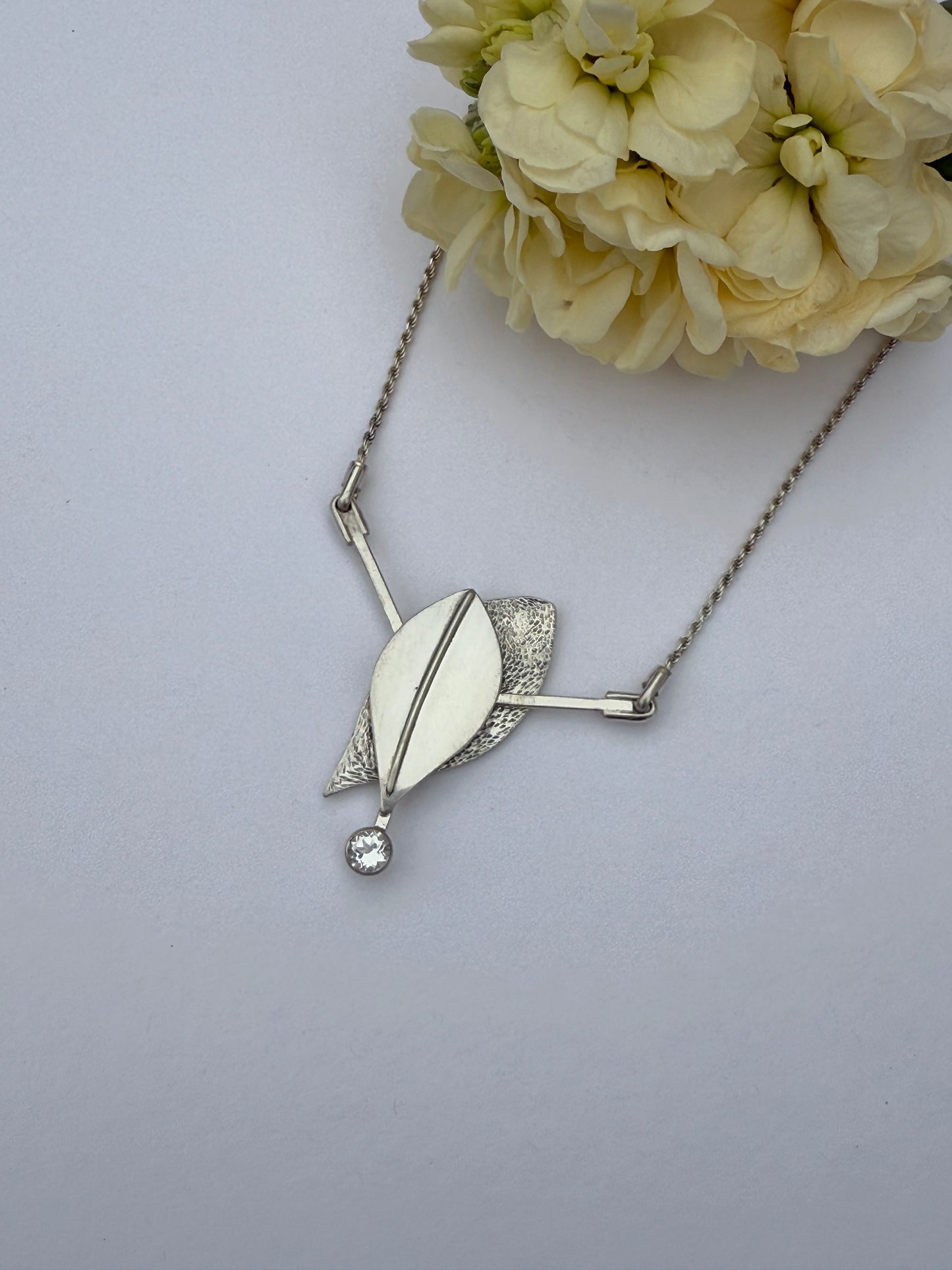 Radiant Renewal Necklace: Sterling Silver & White Topaz Leaf Pendant