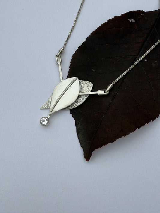 Radiant Renewal Necklace: Sterling Silver & White Topaz Leaf Pendant